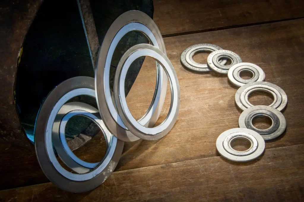 "Polymer-lined sleeve bearing with corrosion-resistant coating" "Spiral wound metallic gasket for heat exchanger" "Kammprofile gasket for high-pressure flange assembly" "Corrugated metal gasket for marine exhaust system" "PTFE non-metallic gasket for chemical pipeline" "Graphite flexible gasket for valve and pump sealing" "Composite gasket combining metal and non-metal layers" "Custom gasket for offshore oilfield pressure vessels" "Industrial hose assembly with UV and seawater resistance" "High-temperature bearing for offshore machinery" "Marine and industrial custom gaskets and bearings set" "Corrosion-resistant gasket for power generation turbines"